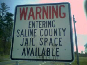 warning-entering-saline-county-jail-space-available-chicot-road-sign