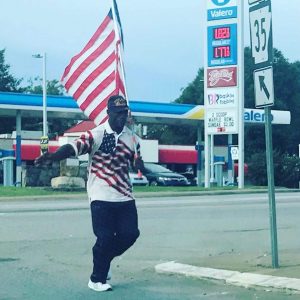 Picture of the Day: War veteran runs with flag in Benton and across the state during pandemic