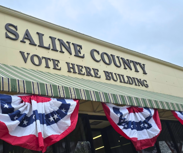 The front of the Saline County Vote Here Building is decorated with red, white and blue bunting, for election time.