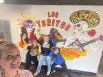 East End teacher and advanced 8th grade art class students paint vibrant mural at local restaurant