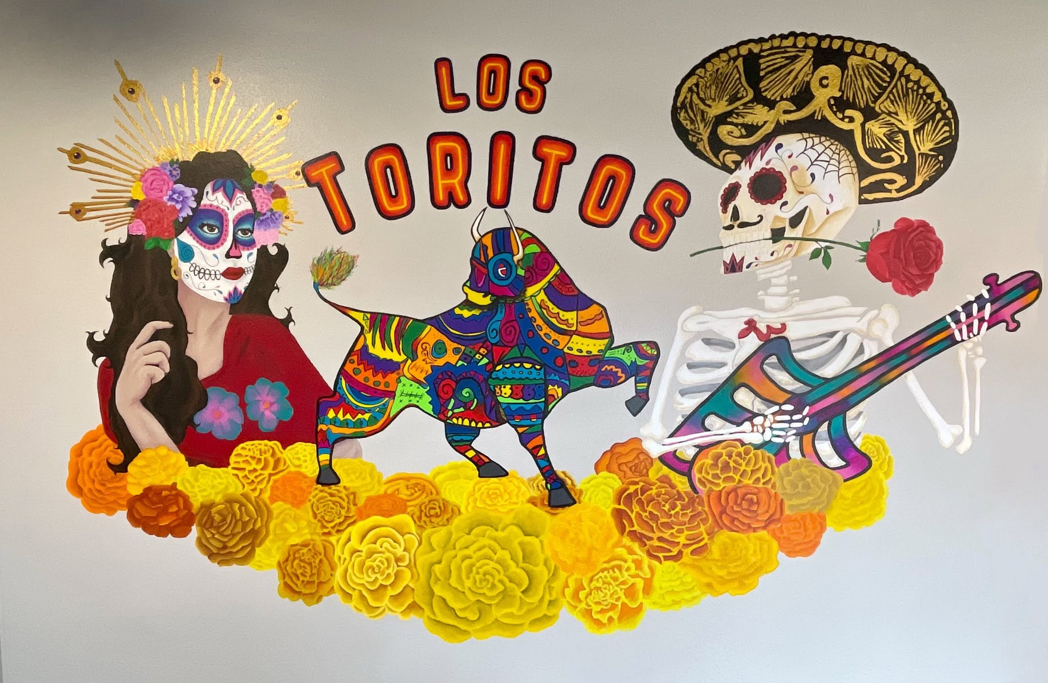 East End teacher and advanced 8th grade art class students paint vibrant mural at local restaurant
